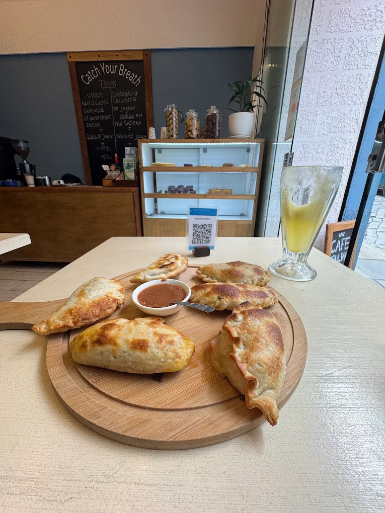 Freshly prepared empanadas with traditional sauces